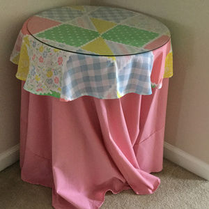 20" table topper with table cloth